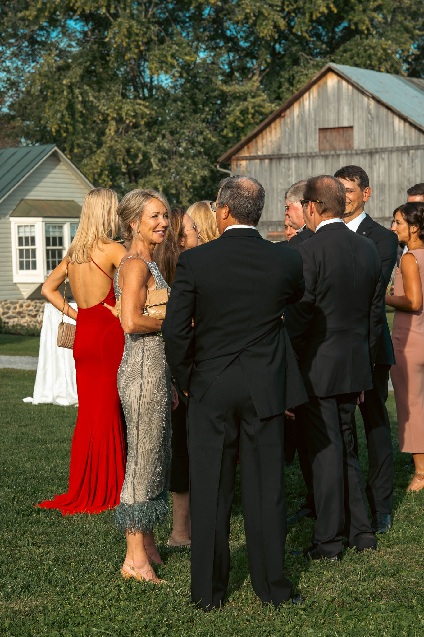 Cocktail hour around the stone barn and the paddocks — Sylvanside Farm wedding in Purcellville, Virginia