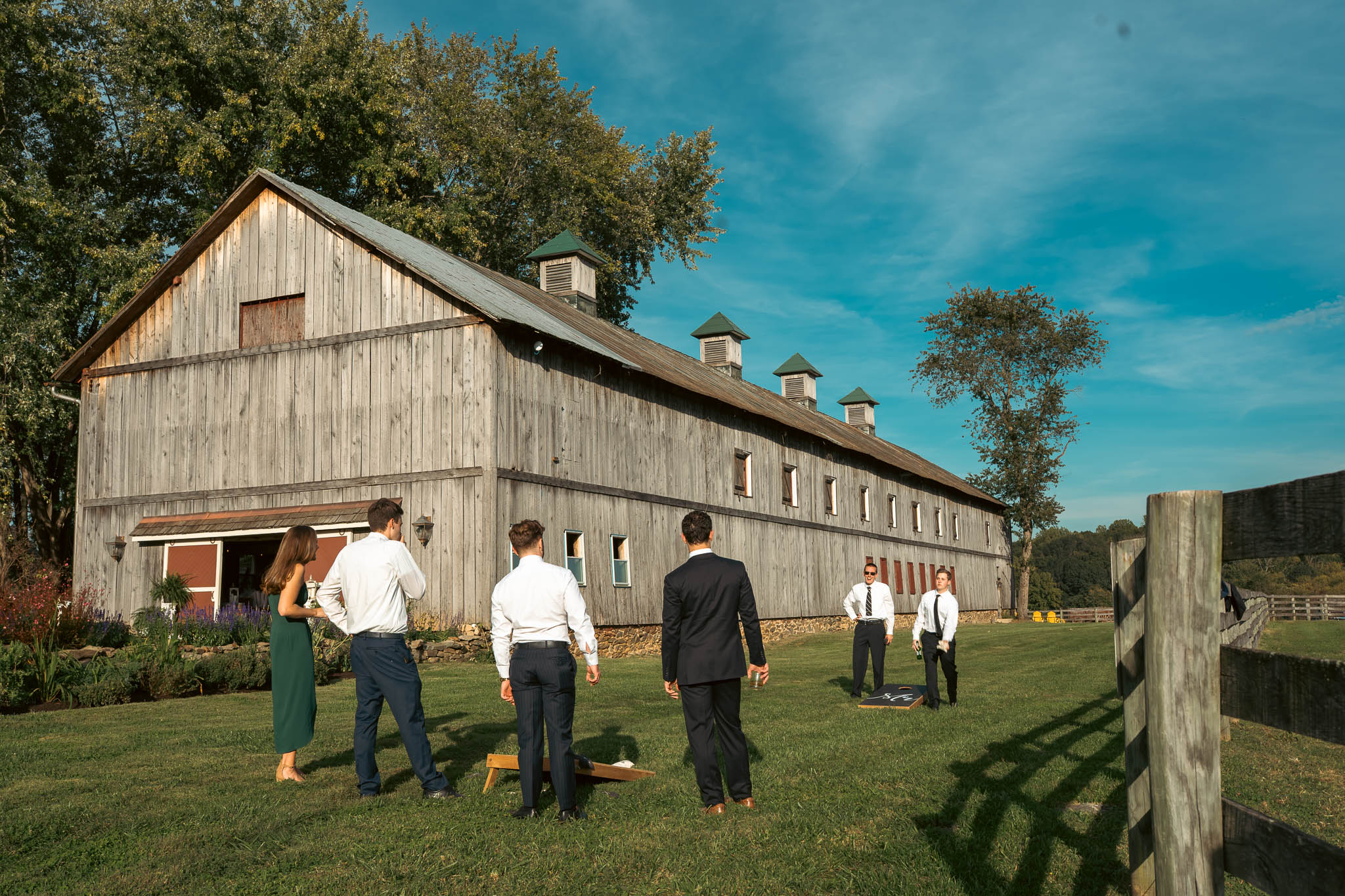 The historic stone bank barn on an autumn afternoon — Sylvanside Farm wedding in Purcellville, Virginia