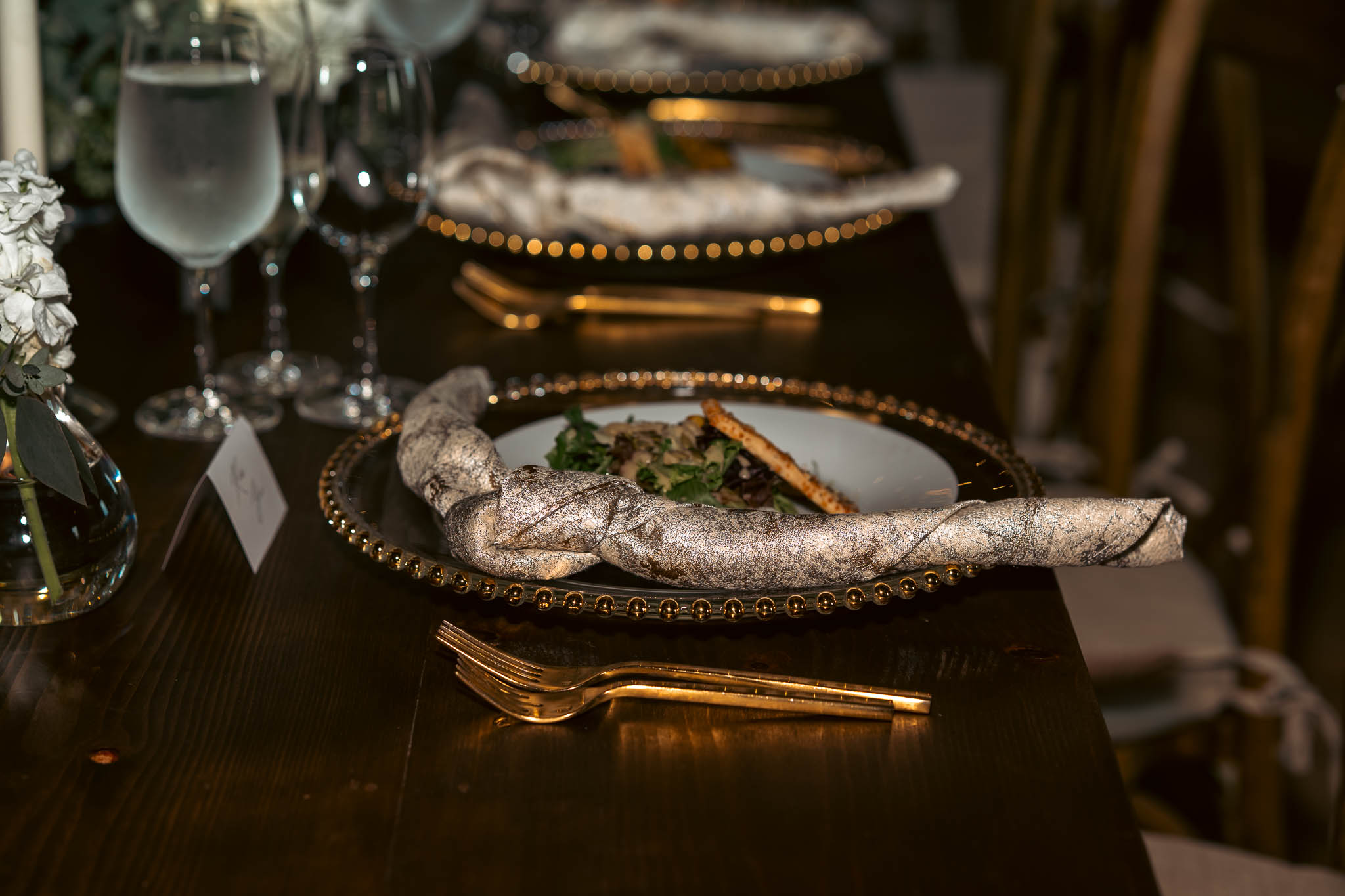 Place setting and autumn centerpiece in the reception barn — Sylvanside Farm wedding in Purcellville, Virginia