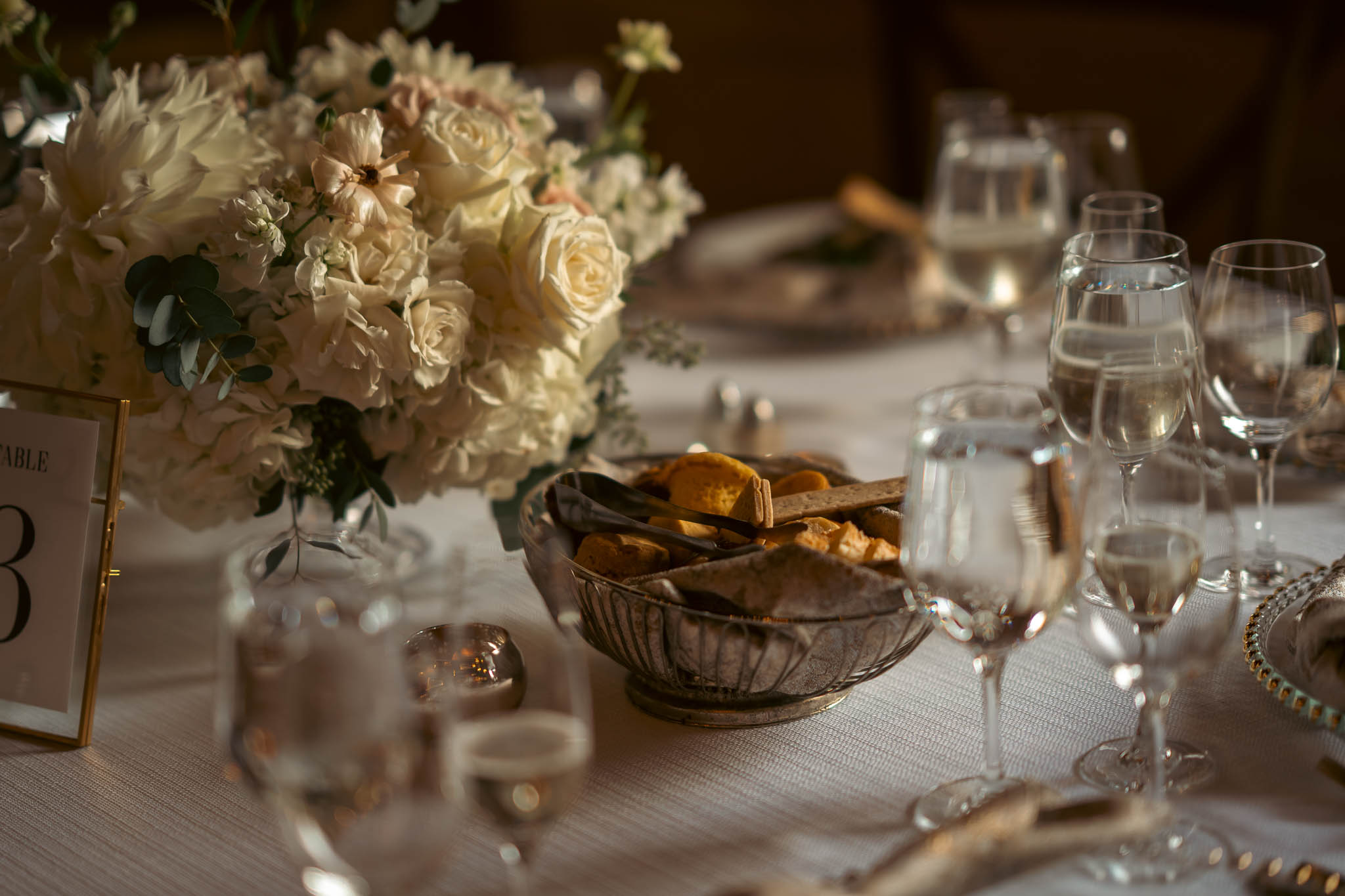 Place setting and autumn centerpiece in the reception barn — Sylvanside Farm wedding in Purcellville, Virginia