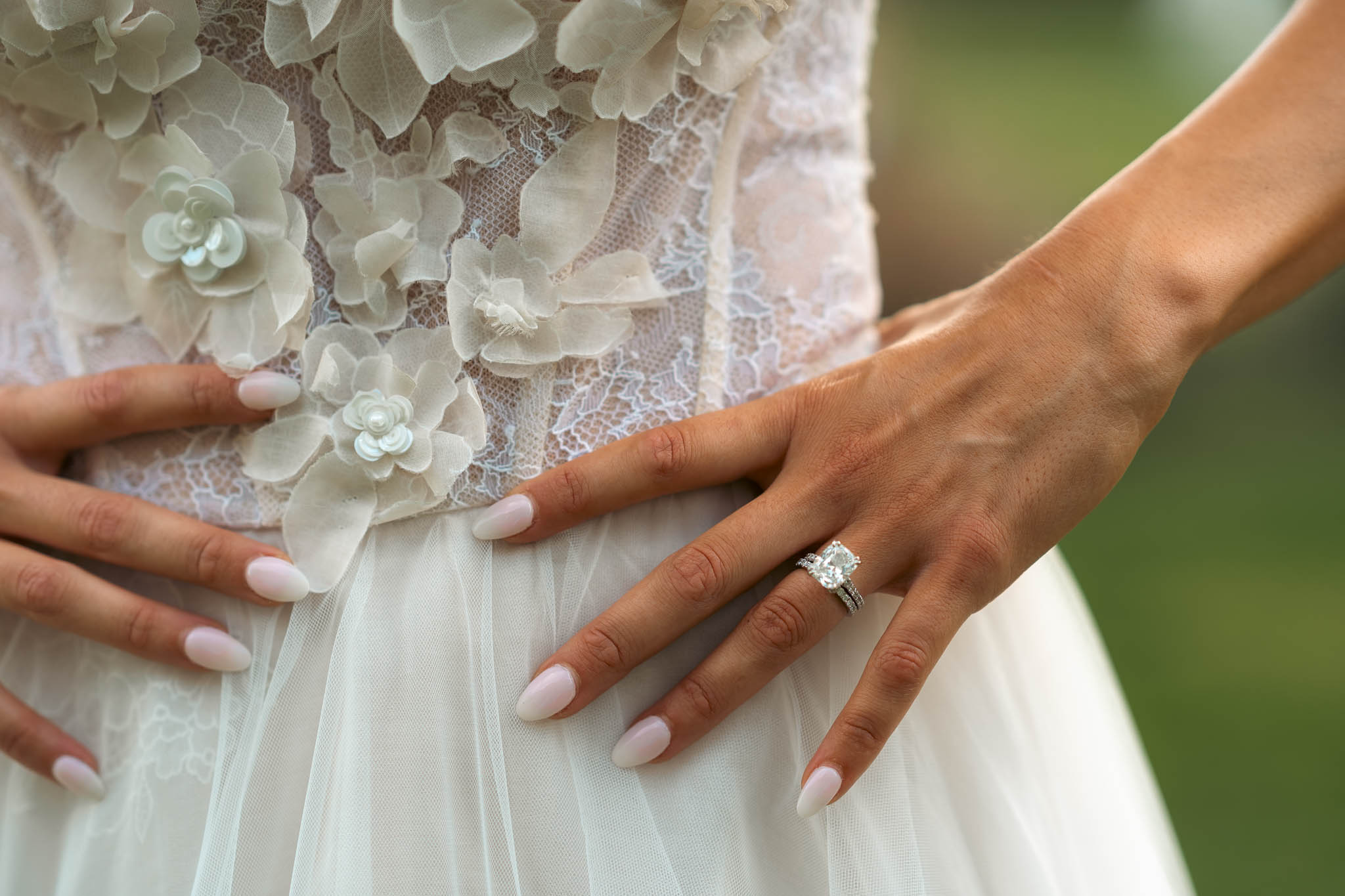 Gown bodice and engagement ring detail at golden hour — Sylvanside Farm wedding in Purcellville, Virginia