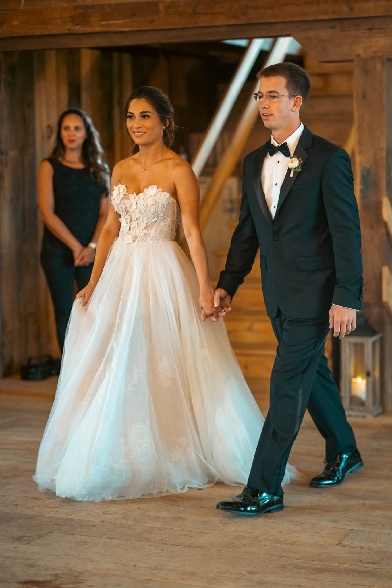 The couple walking into their barn reception — Sylvanside Farm wedding in Purcellville, Virginia