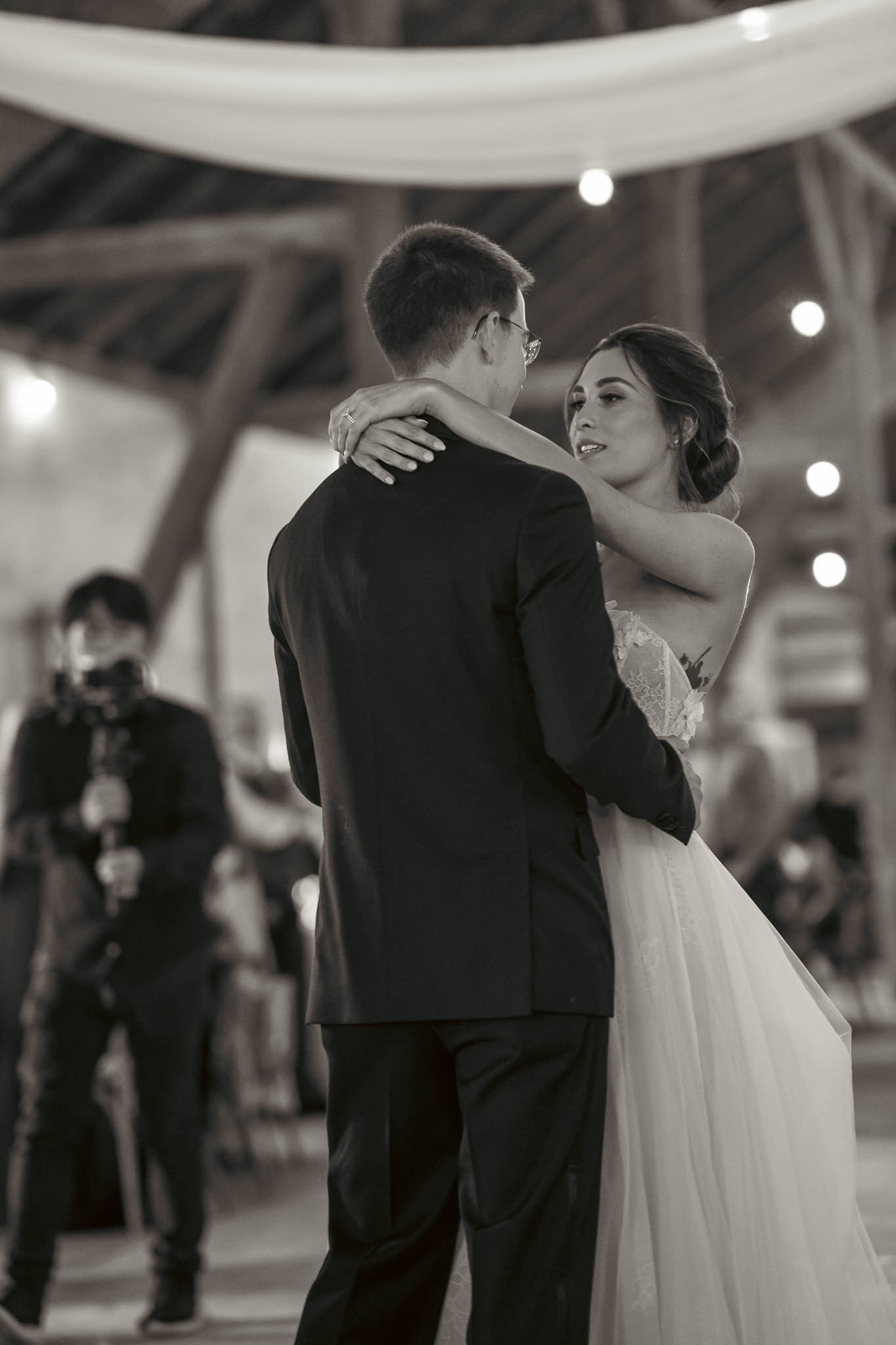 First dance in the timber-frame barn — Sylvanside Farm wedding in Purcellville, Virginia