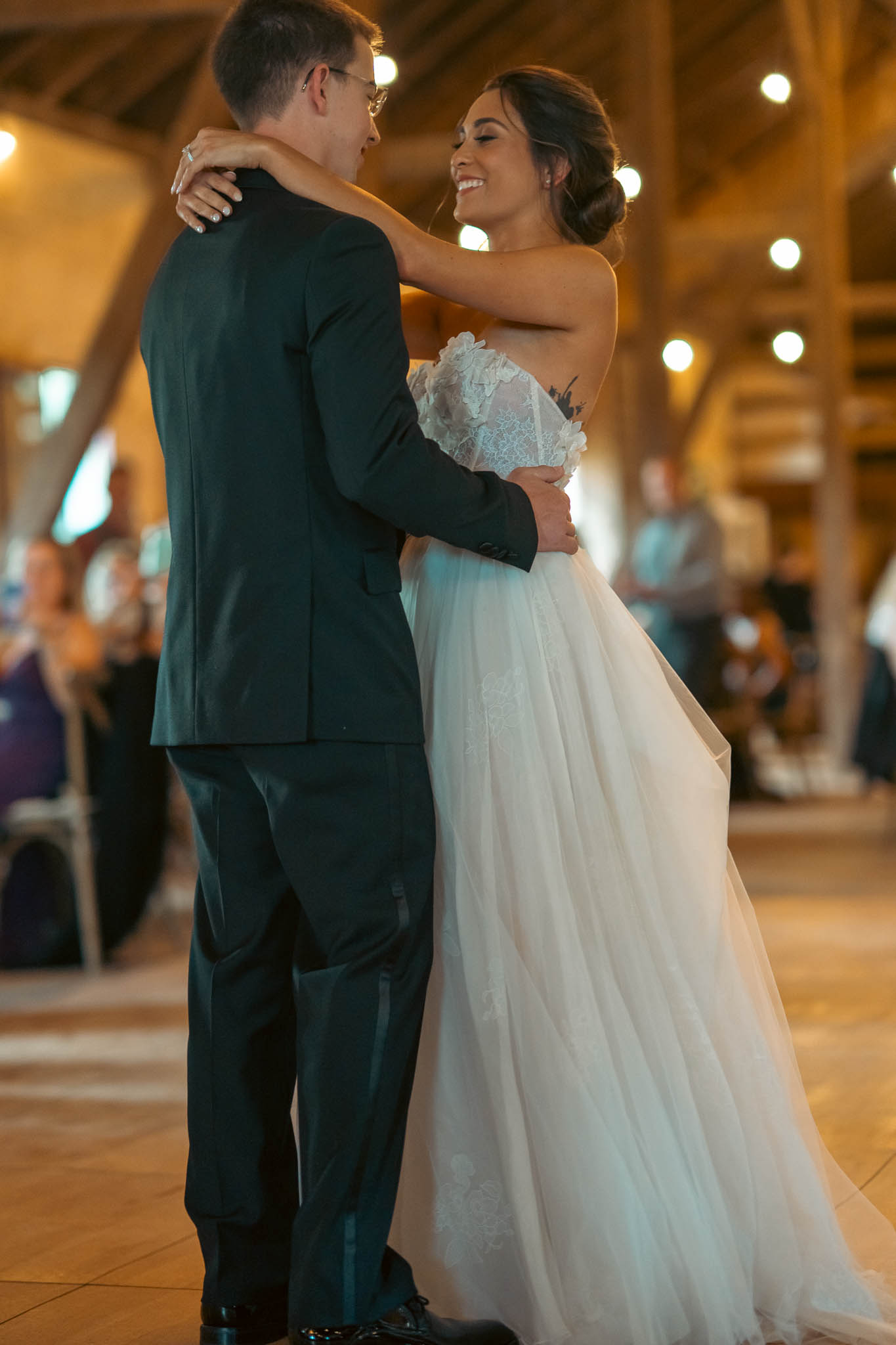 Black and white first dance photograph in the barn — Sylvanside Farm wedding in Purcellville, Virginia
