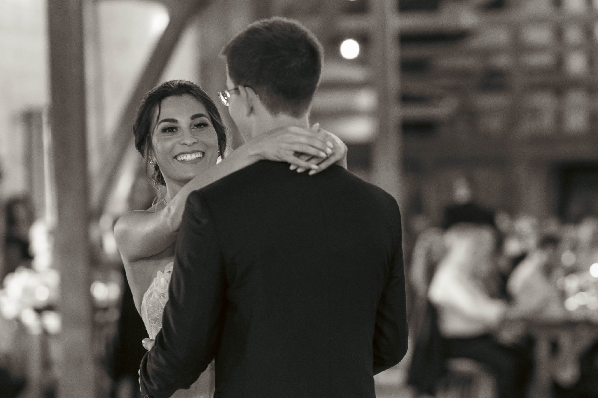 First dance in the timber-frame barn — Sylvanside Farm wedding in Purcellville, Virginia