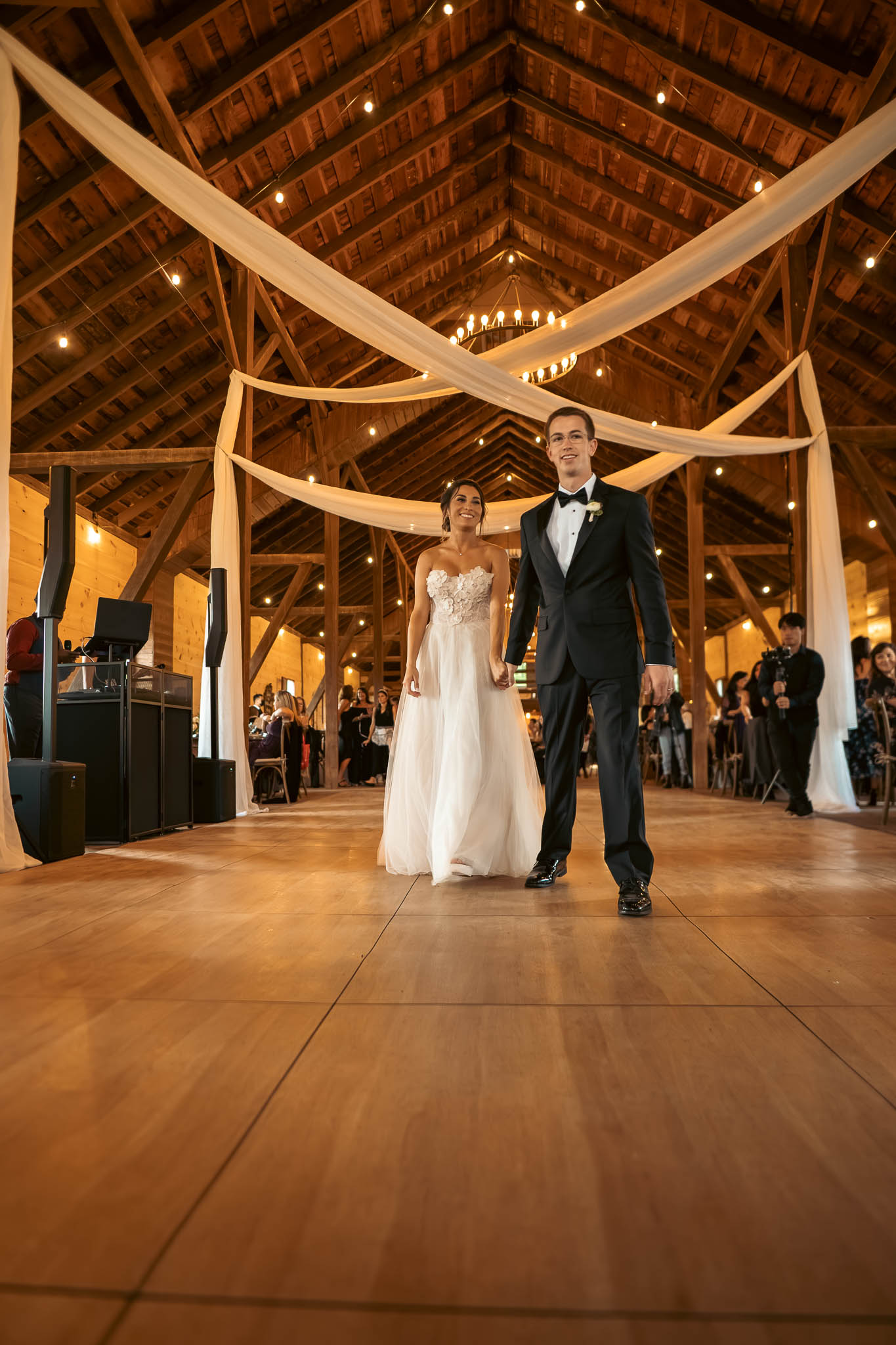 First dance in the timber-frame barn — Sylvanside Farm wedding in Purcellville, Virginia