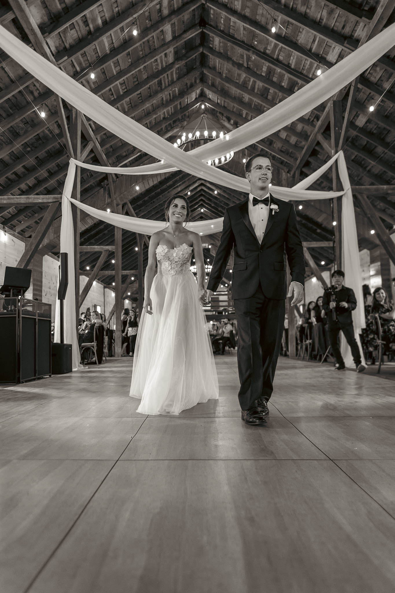 Black and white first dance photograph in the barn — Sylvanside Farm wedding in Purcellville, Virginia