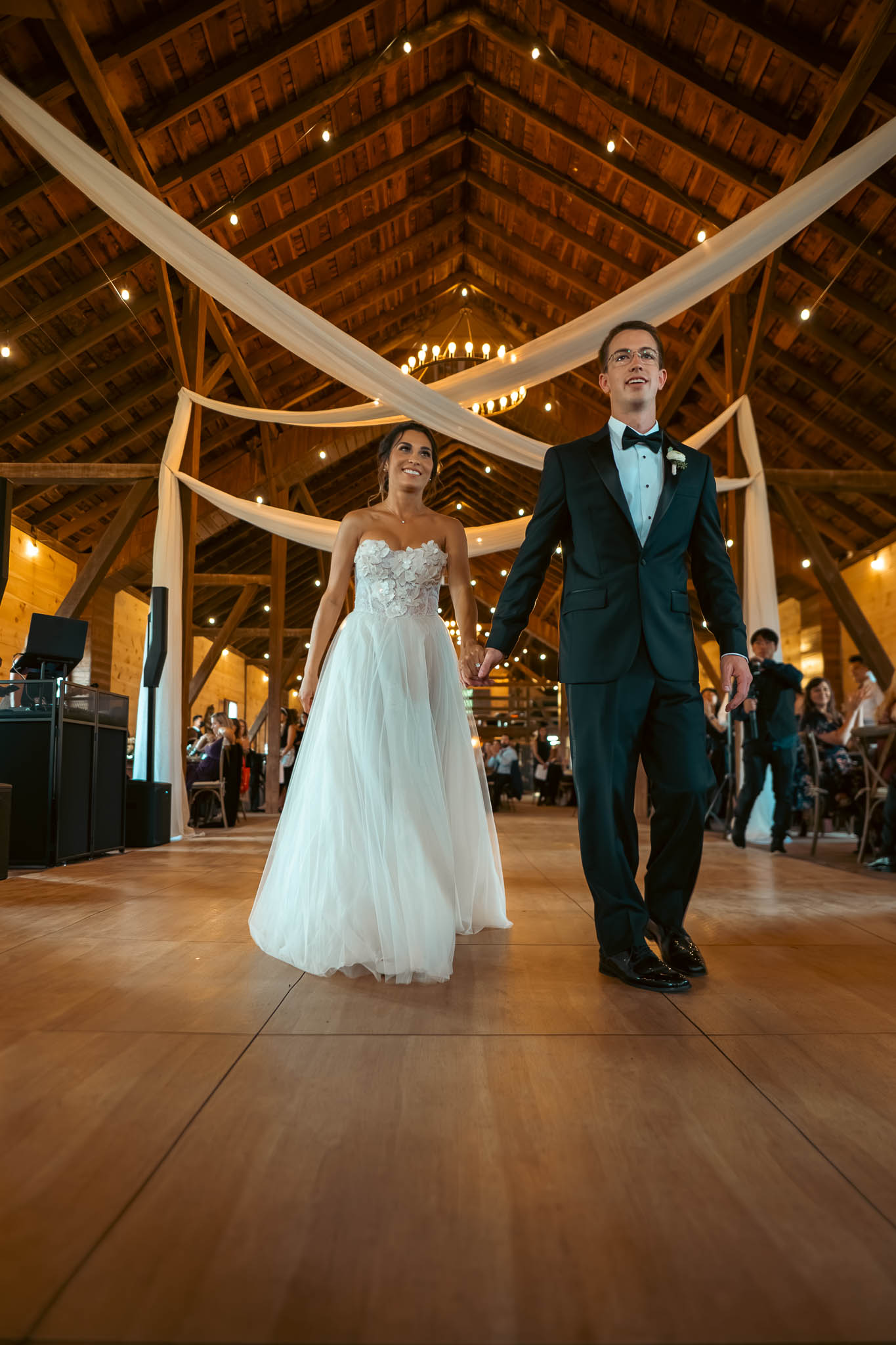 Bride and groom's first dance under the barn string lights — Sylvanside Farm wedding in Purcellville, Virginia