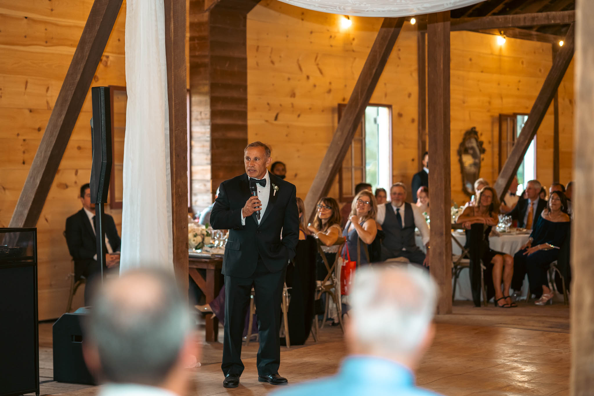 Toasts during dinner in the barn — Sylvanside Farm wedding in Purcellville, Virginia