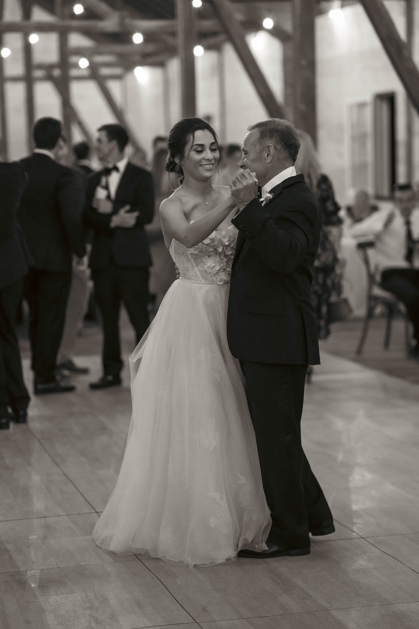 Mother-son dance under the barn string lights — Sylvanside Farm wedding in Purcellville, Virginia