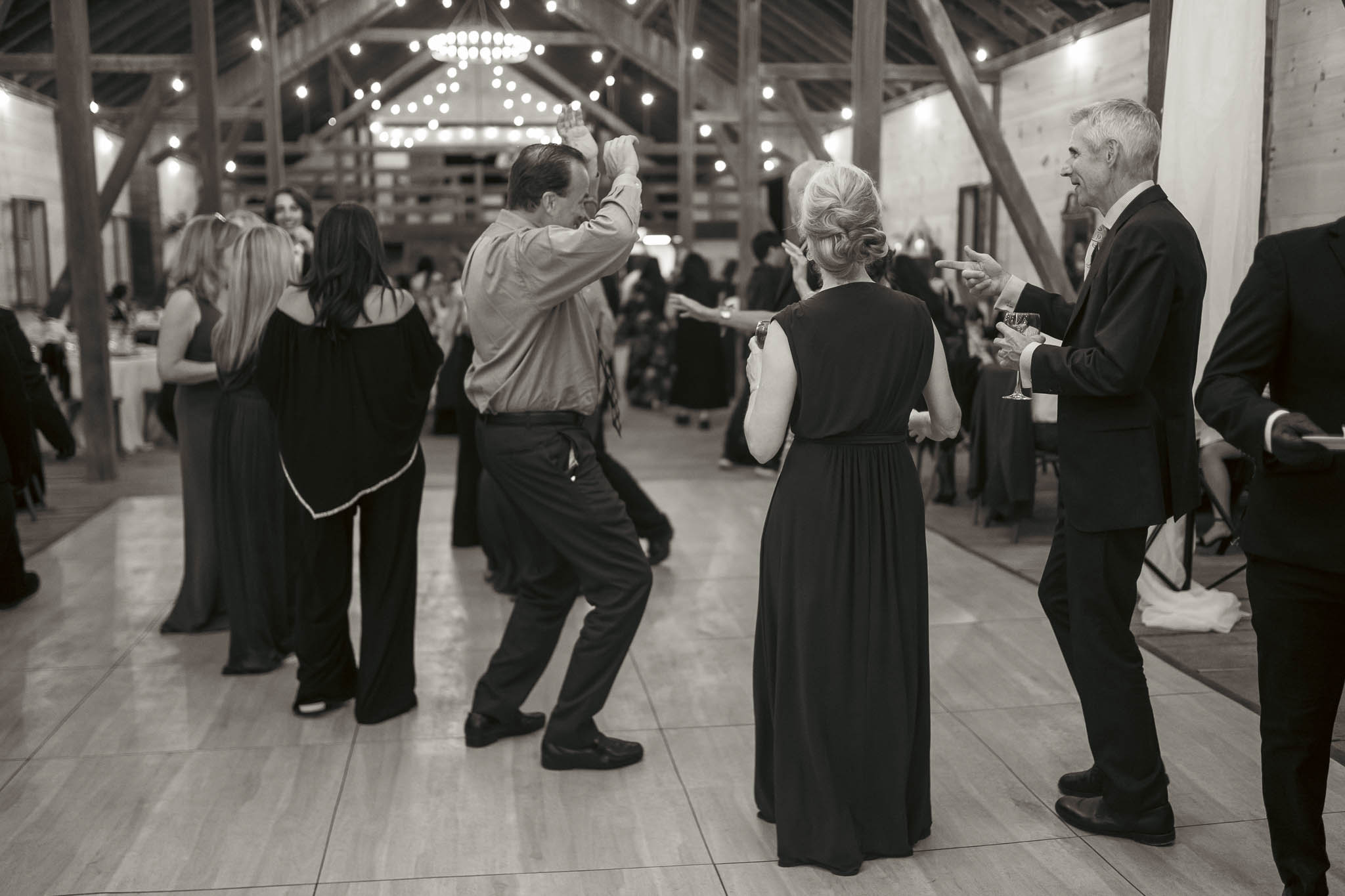 Guests filling the dance floor in the barn — Sylvanside Farm wedding in Purcellville, Virginia