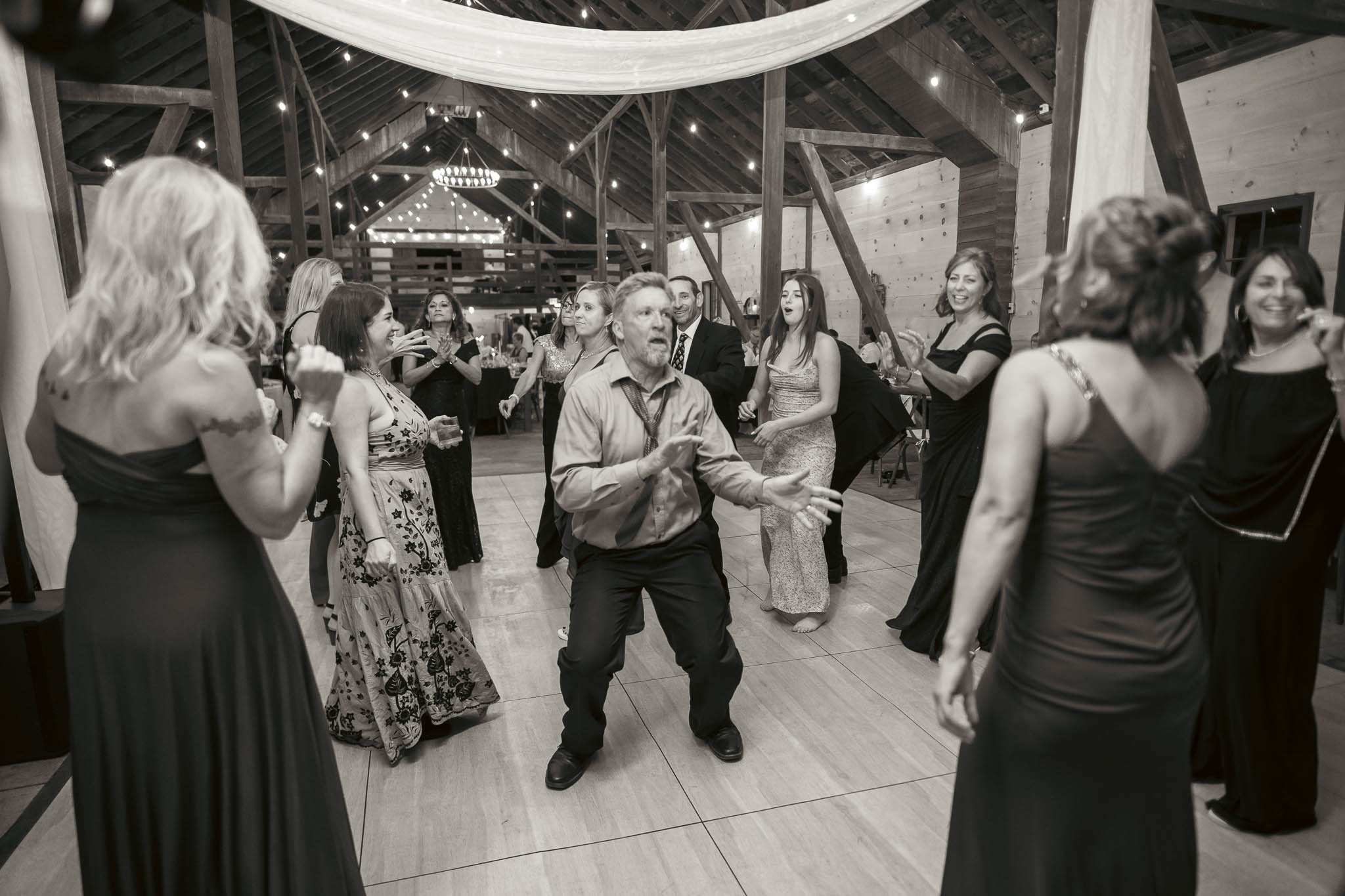 Black and white dance floor photograph at the barn reception — Sylvanside Farm wedding in Purcellville, Virginia
