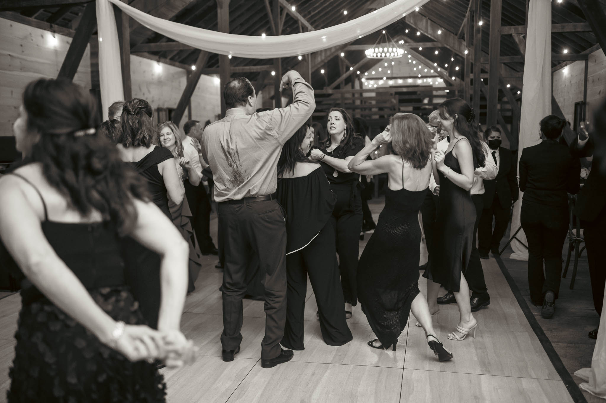 Guests dancing late into the night in the barn — Sylvanside Farm wedding in Purcellville, Virginia