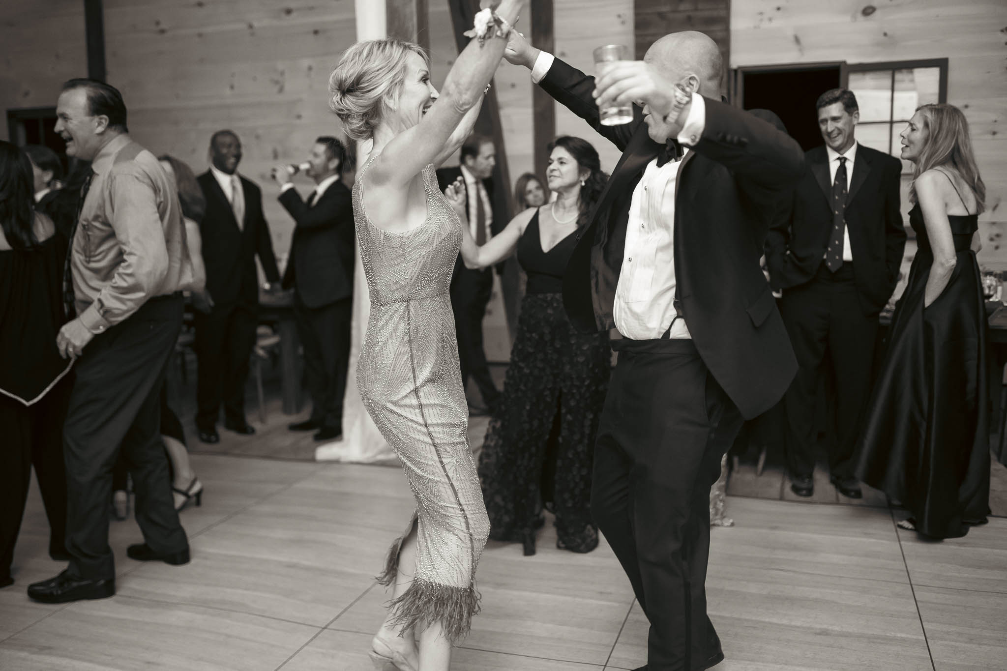 Guests filling the dance floor in the barn — Sylvanside Farm wedding in Purcellville, Virginia